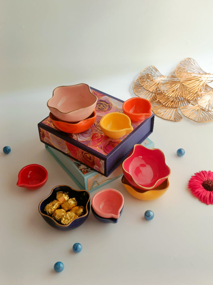 A gift box with ceramic diyas, tealight candle, handmade sweets in a ceramic bowl, a perfect box for ganesh chaturthi, housewarming, diwali and many more occassions.