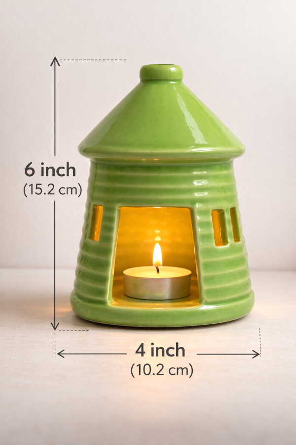 Green ceramic lantern with a lit candle inside, showing dimensions on a white background