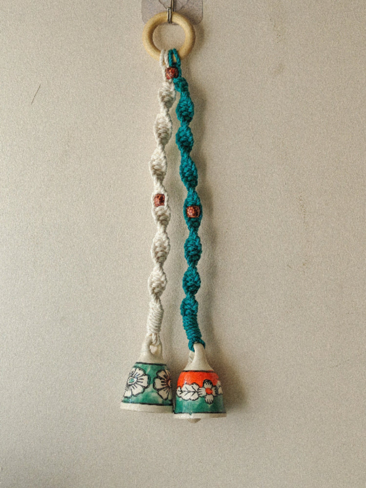 two Small ceramic bells with a macrame knots hanging, ideal for balcony, or window side or main door decor.